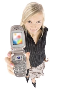 headshot of young blonde woman with moble phone
